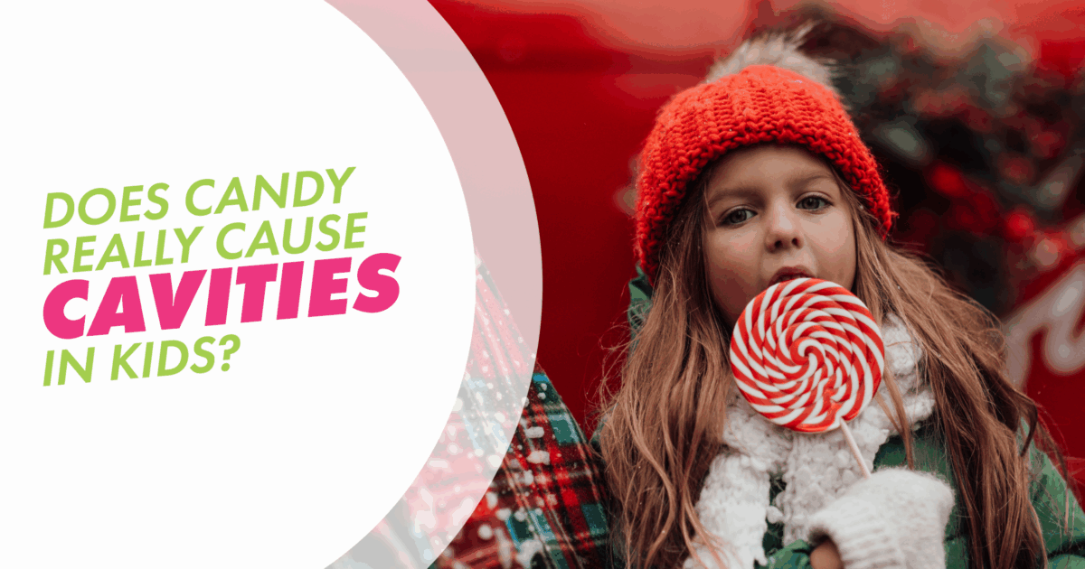 A little girl licking a huge lollipop with a text overlay that says does candy cause cavities in kids?